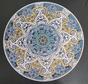 Layered wooden mandala engraving